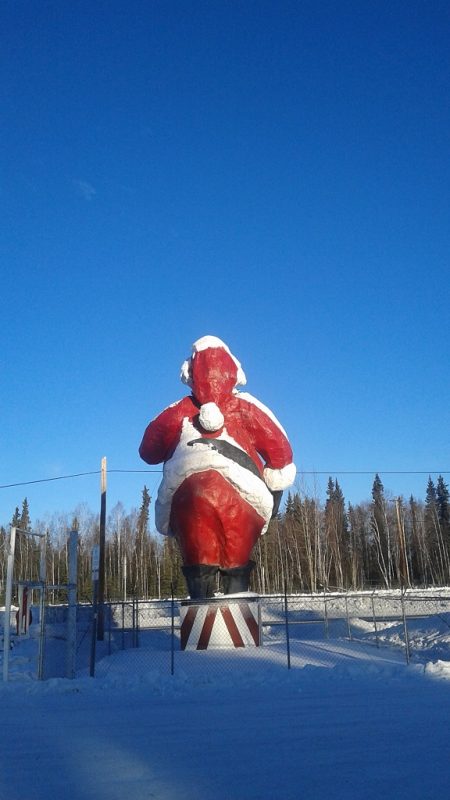 OK - A Gimmicky Santa Claus Stands Proud on Santa Clause Lane